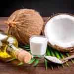 Coconut milk and coconut oil on wooden table