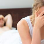 Upset young couple having problems with sex.