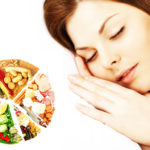 Portrait of the beautiful young woman sleeping in white bed