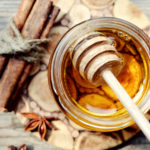Golden honey with honeystick. cinnamon and anise stars