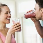 Couple drinking a post workout smoothie