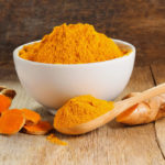Turmeric roots with turmeric powder