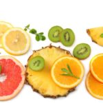 healthy-background-slices-grapefruit-kiwi-fruit-orange-pineapple-isolated-white-top-view-111431362