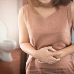 The woman wake up for go to restroom. People with diarrhea problem concept
