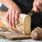 Woman cutting bread