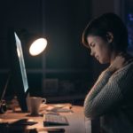 Woman suffering from neck pain