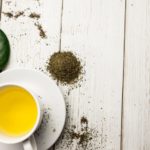 Cup of herbal tea on table