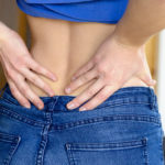 Woman With Hands On Back