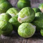 Brussels sprouts cabbage on old wooden table
