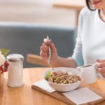 Attractive woman having a meal.