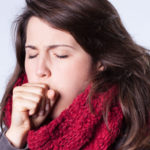 Coughing girl in scarf