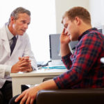 Doctor Treating Male Patient Suffering With Depression