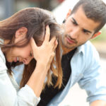 Muslim man comforting a sad girl mourning