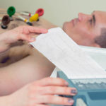 close up of patient and doctor taking notes