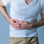 young man having a stomachache