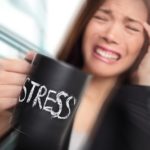 Stress – business person stressed at office. Business woman hold