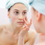 Young woman in bathroom