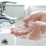Washing of hands with soap under running water