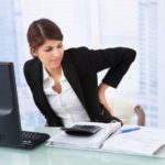 Woman with back pain at computer.jpg.838x0_q67_crop-smart