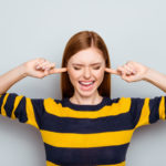 Negative mood pms scream routine failure loser headache struggle concept. Portrait of sad unhappy upset disappointed frustrated shouting exhausted manager closing ears isolated on gray background
