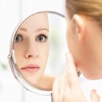 young beautiful healthy woman and reflection in the mirror
