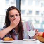 sleepy-woman-eating-breakfast