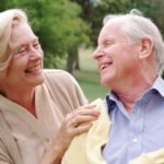 Couple laughing together — Image by © Norbert Schaefer/CORBIS