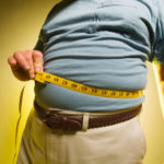 Man measuring his waist