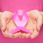 Woman with breast cancer awareness ribbon