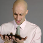Balding Man Holding Hair