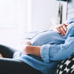 pregnant-mother-holding-her-stomach