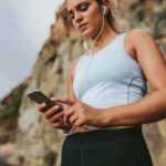 woman-checking-phone-while-running