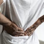 person-experiencing-lower-back-pain