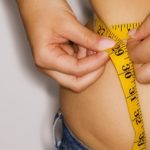 Woman measuring waist