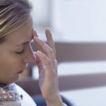 Woman Suffering From A Headache