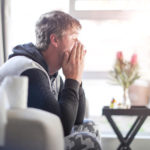 an Adult male sick at home.