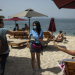 APTOPIX Virus Outbreak Greece Beaches
