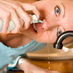 woman doing nasal cleanse
