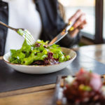 woman eating green healthy salad