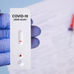 Positive test result by using rapid test for COVID-19, quick fast antibody point of care testing. Lab performing rapid diagnostic test for antibodies to detect presence of antigens COVID-19 disease.