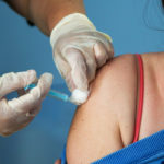 A Covid-19 vaccinator administers the Oxford/AstraZeneca