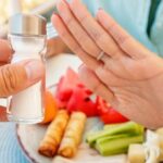 Woman,In,A,Restaurant,Refuses,The,Offered,Salt,And,Pepper
