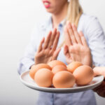 Woman refusing to eat eggs