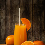 Fresh orange juice in a glass and fresh orange