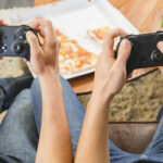 friends-eating-pizza-playing-console