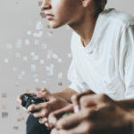 Young gamer in pixel dispersion style