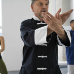 medium-shot-people-practicing-tai-chi