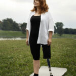 woman-wit-prosthetic-leg-doing-yoga