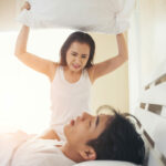 Young woman bored with her boyfriend snoring