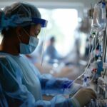 woman-hospital-gown-is-using-computer